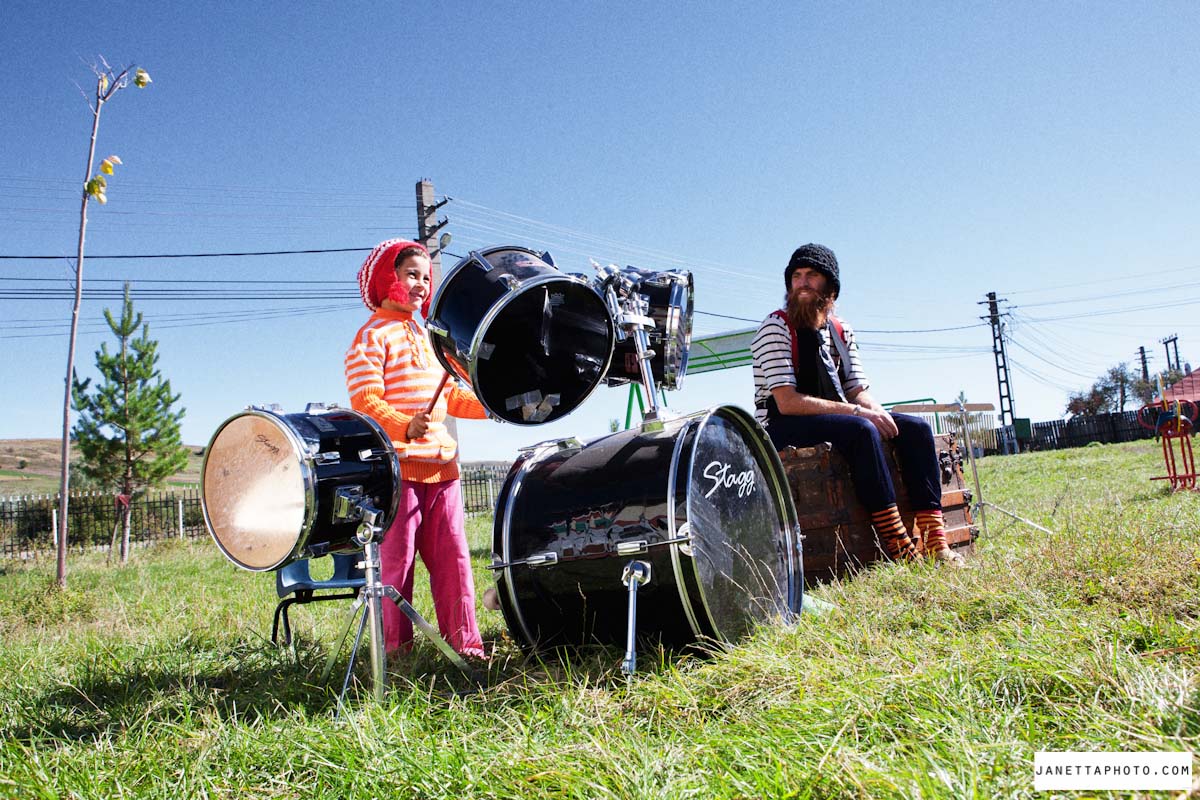 Child in Romania playing on a drum kit