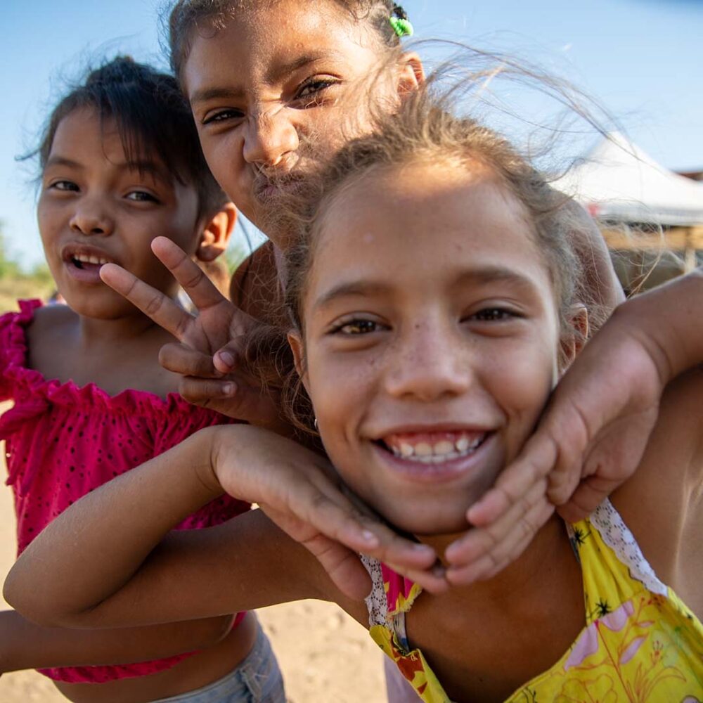 Children smiling during a visit from The Flying Seagull Project.